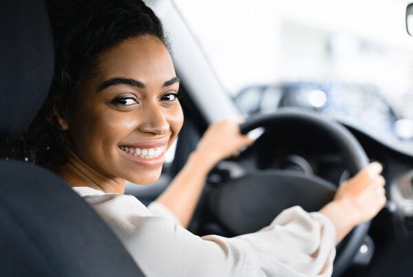 Livery Insurance - Close-up Portrait of a Woman Driver of a Car Service Smiling at the Camera